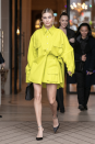 <p>The model and wife of Justin Bieber attended the ‘Americans in Paris’ cocktail party wearing a neon yellow coat dress by Matthew Adams Dolan. <em>[Photo: Getty]</em> </p>