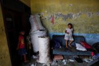 The Wider Image: Cash for trash: Indonesia village banks on waste recycling