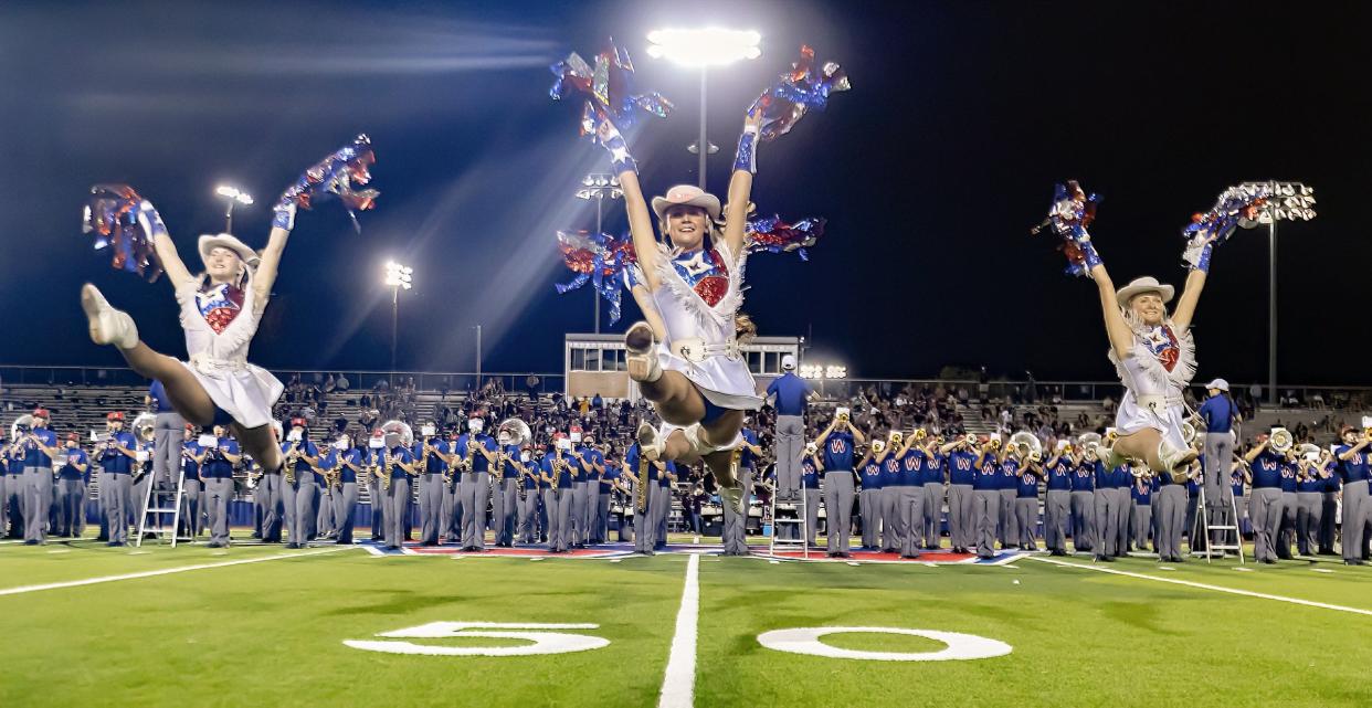 Members of Westlake High School's marching band and Hyline dancers perform during halftime of the Oct. 13 game against Dripping Springs at Chaparral Stadium. The Central Texas regular season winds up this week with several key games across Central Texas.