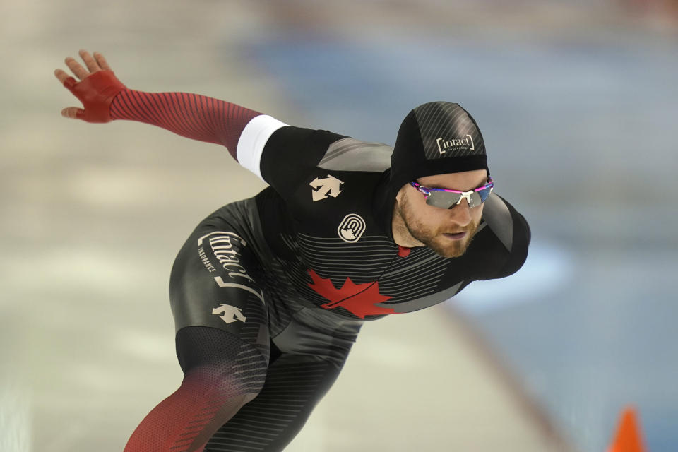 Canada's Laurent Dubreuil skates during the men's 500-meter World Cup speedskating race at the Utah Olympic Oval, Friday, Dec. 3, 2021, in Kearns, Utah. (AP Photo/Rick Bowmer)