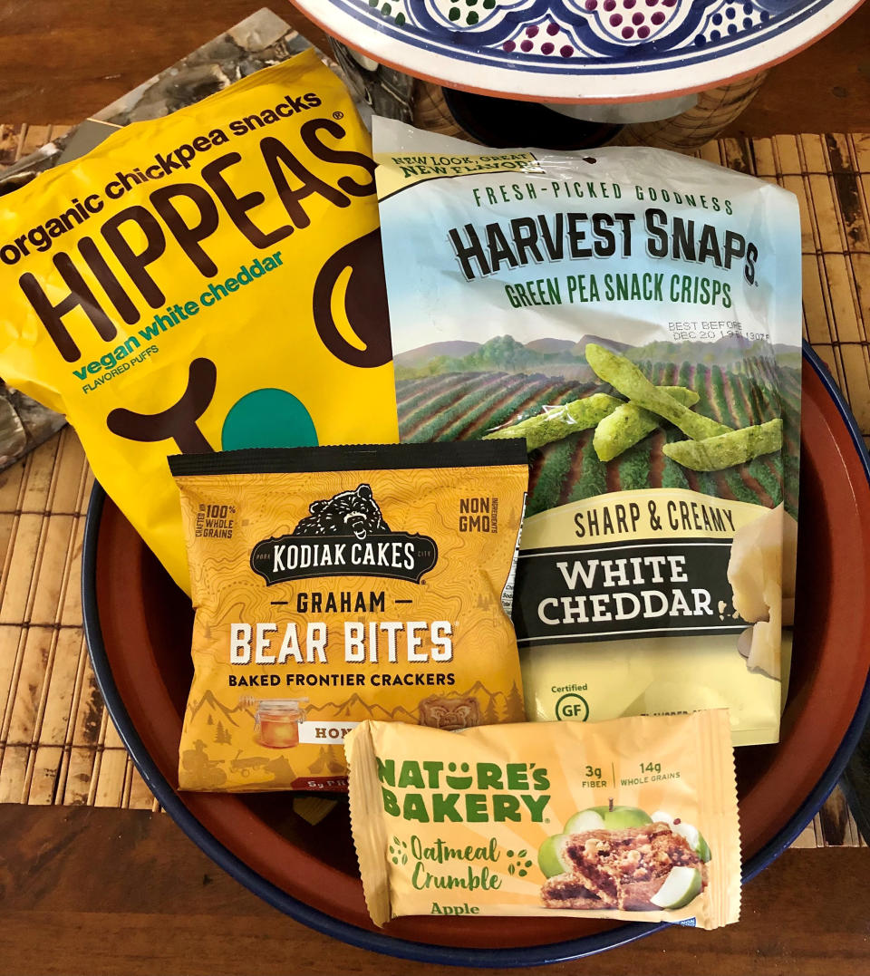 Hippeas, Harvest Snaps, Nature’s Bakery, and Kodiak Cakes make grab-and-go snacks with a little fiber and protein. (Heather Martin)