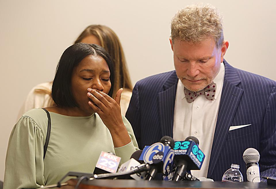 Chauvaun Harris (left) fights back tears as she talks about the attack on her son by Delaware State Police trooper Dempsey Walters who has been charged in the incident.