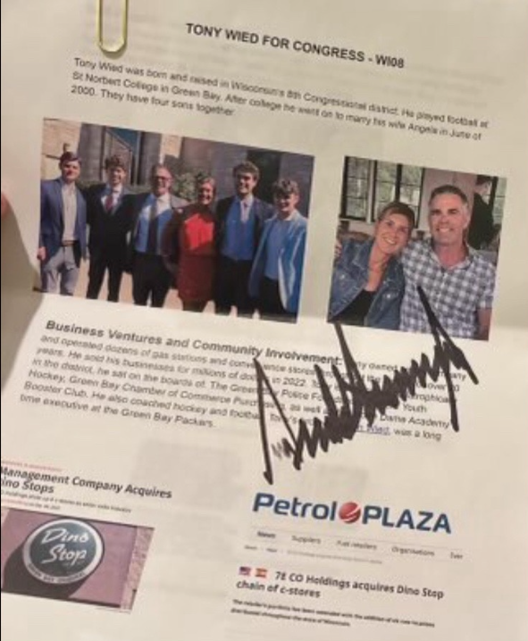 Tony Wied brought a document titled "Tony Wied for Congress — WI08" and met with former President Donald Trump at his Green Bay rally on April 2 2024. An image obtained by the Journal Sentinel shows Trump signed the document.
