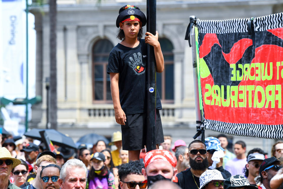 A young person attends an Invasion Day rally in Brisbane today. Source: AAP