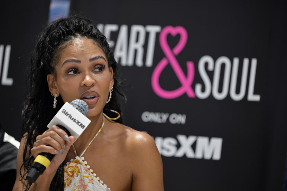 Meagan Good speaking into a microphone at a SiriusXM event promoting "Heart & Soul" radio channel