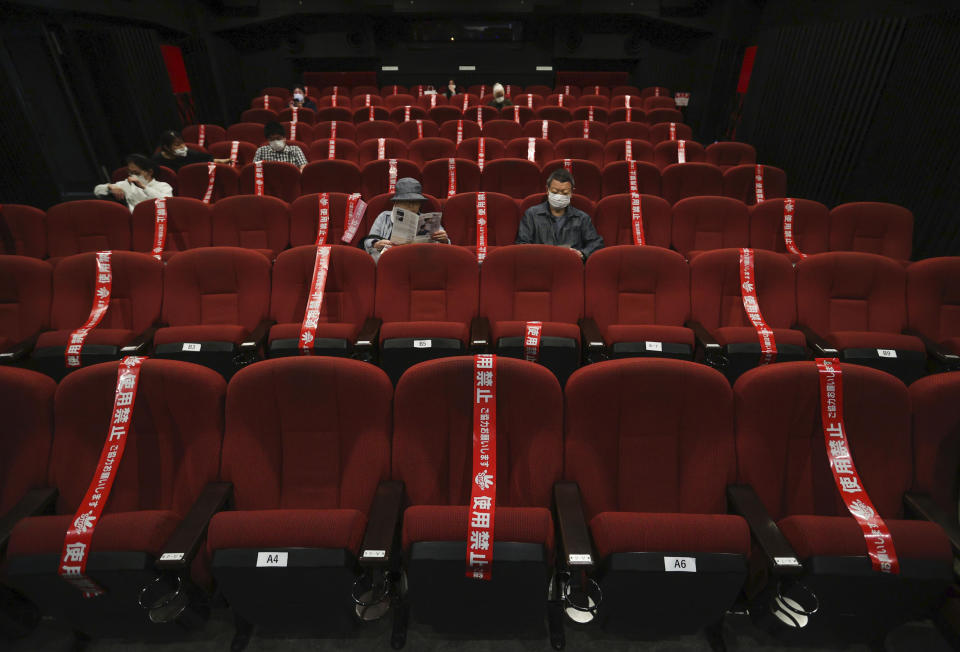 CORRECTS SLUG: Red tape blocks off some seats in an attempt to promote social distancing at a movie theater which reopened on May 22, in Kyoto, western Japan, Saturday, May 23, 2020. Japan has lifted the coronavirus state of emergency in Osaka and the two neighboring prefectures of Kyoto and Hyogo while keeping the measure in place in the Tokyo region and the northernmost island of Hokkaido. (Kyodo News via AP)