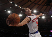 New York Knicks point guard Pablo Prigioni saves the ball from going out of bounds against the New Orleans Hornets in the second half of their NBA basketball game at Madison Square Garden in New York, January 13, 2013. REUTERS/Adam Hunger (UNITED STATES - Tags: SPORT BASKETBALL)