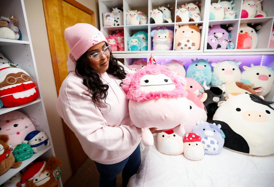 Hailey Porter, 31, shows a Squishmallows toy that she made into a backpack at her home on Tuesday, Aug. 22, 2023.