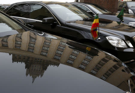 FILE PHOTO: The building of the Russian Foreign Ministry is reflected in a motor hood of a car during a briefing for foreign ambassadors in Moscow, Russia March 21, 2018. REUTERS/Sergei Karpukhin/File Photo