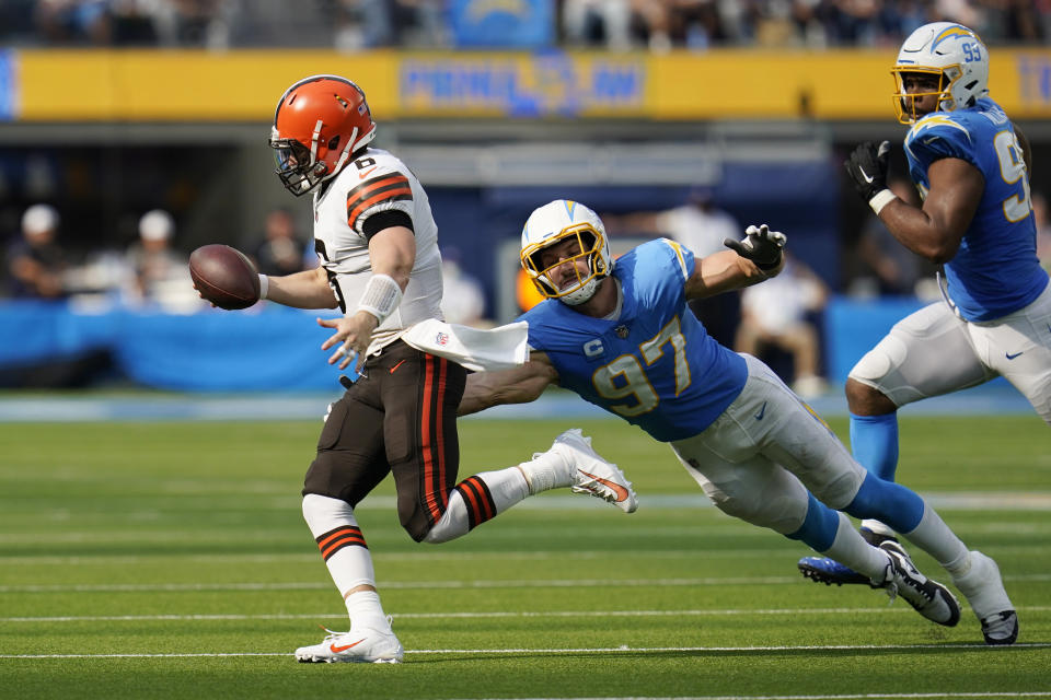 Los Angeles Chargers defensive end Joey Bosa (97) goes after Cleveland Browns quarterback Baker Mayfield during the second half of an NFL football game Sunday, Oct. 10, 2021, in Inglewood, Calif. (AP Photo/Gregory Bull)