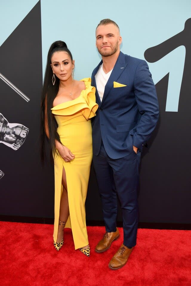 The 'Jersey Shore' star and her handsome new beau spoke with ET at this year's star-studded awards show.