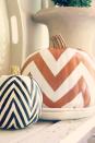 <p>This classic print looks great on any pumpkin. Create perfectly even lines by painting over a taped-on pattern. </p><p>Get the tutorial at <a href="http://www.mysweetsavannahblog.com/2012/09/diy-chevron-pumpkins.html" rel="nofollow noopener" target="_blank" data-ylk="slk:My Sweet Savannah;elm:context_link;itc:0;sec:content-canvas" class="link ">My Sweet Savannah</a>.</p>