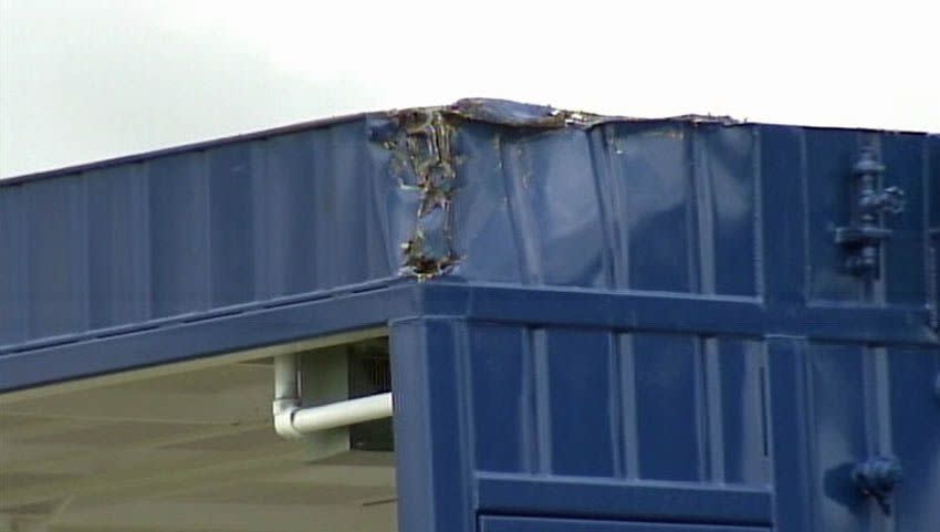 An oversize blue steel trailer on a semi-truck was carrying drilling equipment when it slammed into several trusses of the I-5 Skagit River overpass.