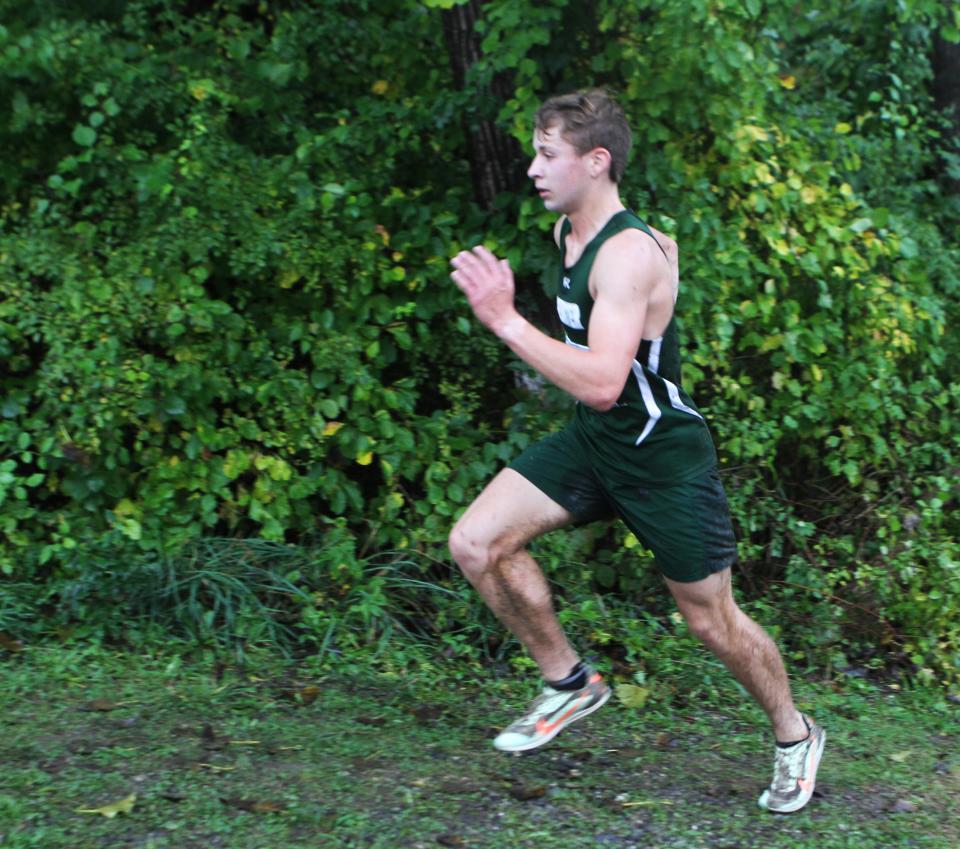 Brewster's Liam Ford goes up a small hill en route to finishing second at the Dan  Purdy Memorial Cross-Country Invitational at Pawling High Sept. 30, 2023.