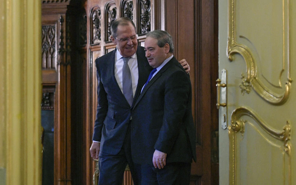 FILE - Russian Foreign Minister Sergey Lavrov, left, and Syrian Foreign Minister Faisal Mekdad enter a hall for a news conference following their talks in Moscow, on Feb. 21, 2022. (Alexander Nememov/Pool Photo via AP, File)