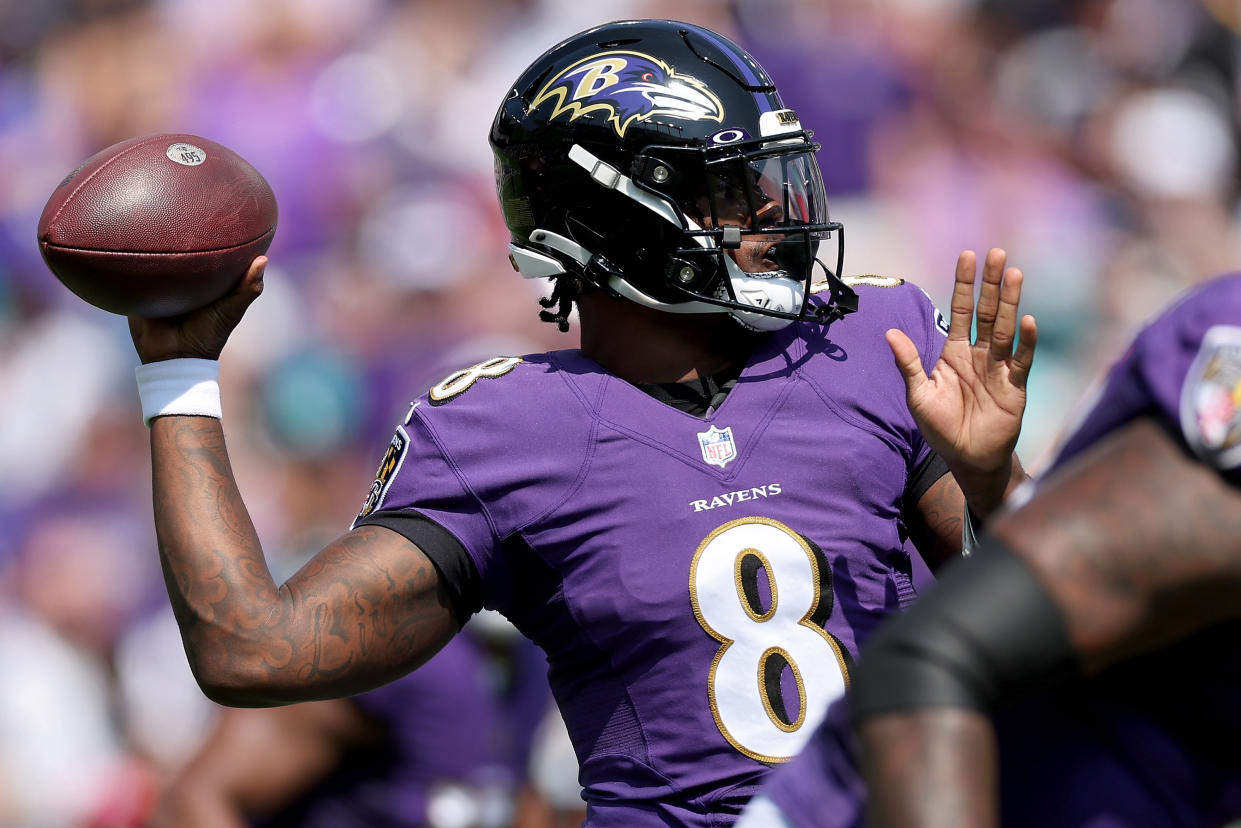 Baltimore Ravens quarterback Lamar Jackson is off to a scorching start this season. But he suddenly appeared on the injury report this week. (Photo by Patrick Smith/Getty Images)
