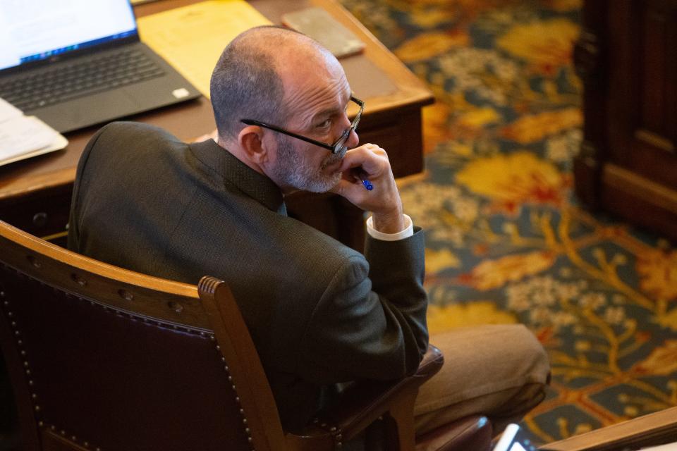 Sen. Mark Steffen, R-Hutchinson, looks back toward Sen. Caryn Tyson, R-Parker, Tuesday during the senate session inside the Statehouse.