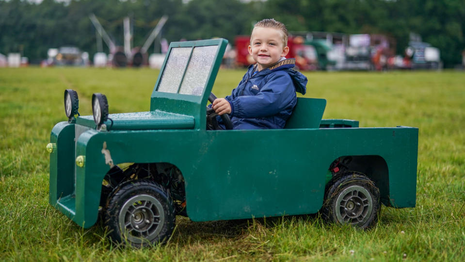 Stuart Coglan, 3, from Bishop Auckland drives his battery powered model Land Rover across the show ground at the Great Yorkshire Steam and Vintage Rally on July 02, 2022 in Helmsley, North Yorkshire.