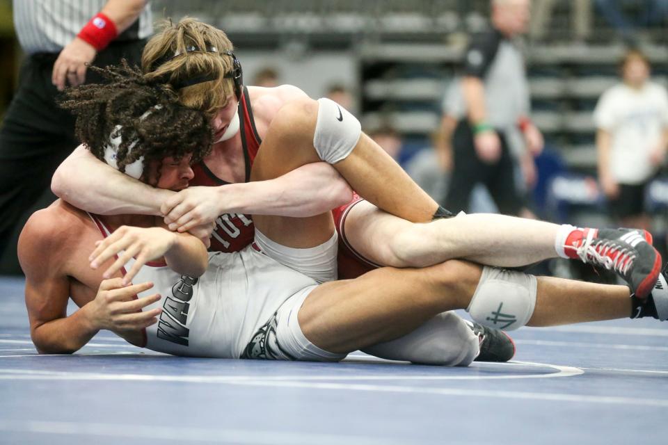 Tuttle's Tucker Waitman, top, attempts to turn Wagoner's Witt Edwards during the 2022 Class 4A dual state wrestling tournament finals at Stride Bank Center in Enid.
