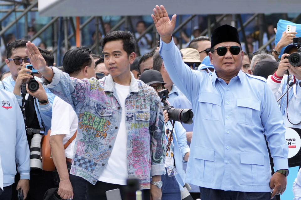 Presidential candidate Prabowo Subianto, centre right, and his running mate Gibran Rakabuming Raka, the eldest son of Indonesian President Joko Widodo, greet their supporters during their campaign rally at Gelora Bung Karno Main Stadium in Jakarta, Indonesia, Saturday, Feb. 10, 2024. Defense Minister Subianto, a wealthy ex-general with ties to both Indonesia’s popular outgoing president and its dictatorial past looks set to be its next president, after unofficial tallies showed him taking a clear majority in the first round of voting.(AP Photo/Achmad Ibrahim, File)