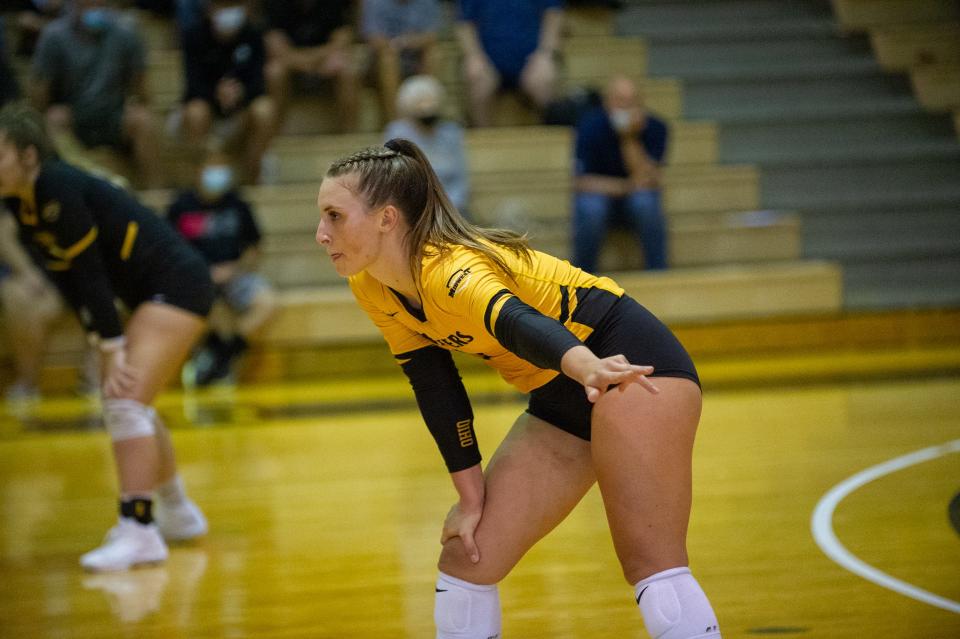 Kelsey Shoup awaits a serve at Ohio Domincan.