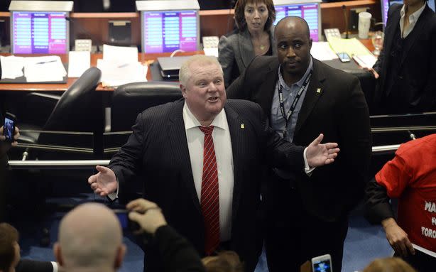 Toronto Mayor Rob Ford argues with members of the gallery in Toronto City Hall Monday.