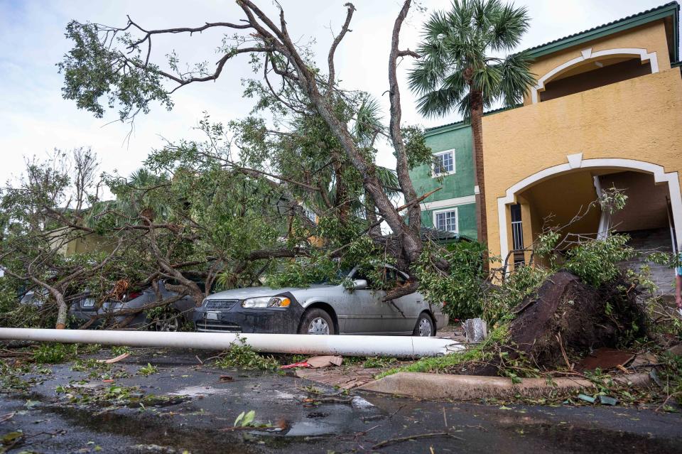 Damage in the aftermath of a Saturday evening tornado at Sanctuary Cove apartments in North Palm Beach. The National Weather Service confirmed Sunday an EF-2 tornado struck Palm Beach Gardens and North Palm Beach just after 5 p.m. Saturday.