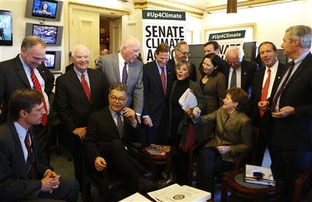 U.S. Senators from the Senate Climate Action Task Force gather before holding the Senate floor to urge action on climate change, on Capitol Hill in Washington March 10, 2014. REUTERS/Yuri Gripas
