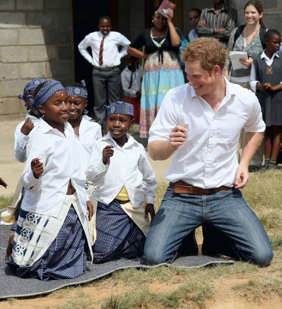 <p>Harry dances with children during at visit to the Kananelo Centre for the deaf in Maseru, Lesotho. </p>