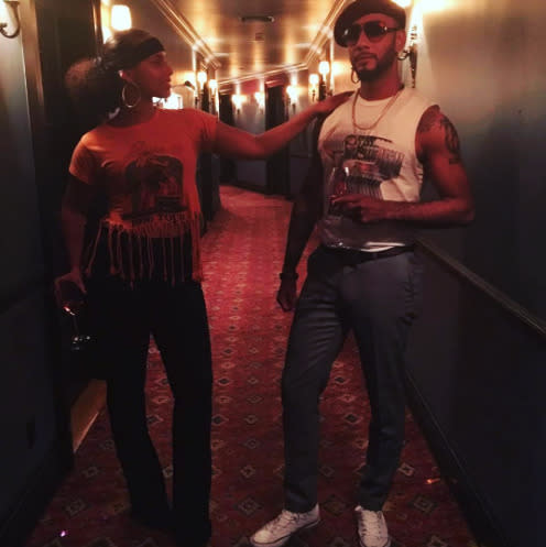 Alicia Keys and her hubby Swizz Beats got their best 70s get-ups on wearing printed tees and jeans.