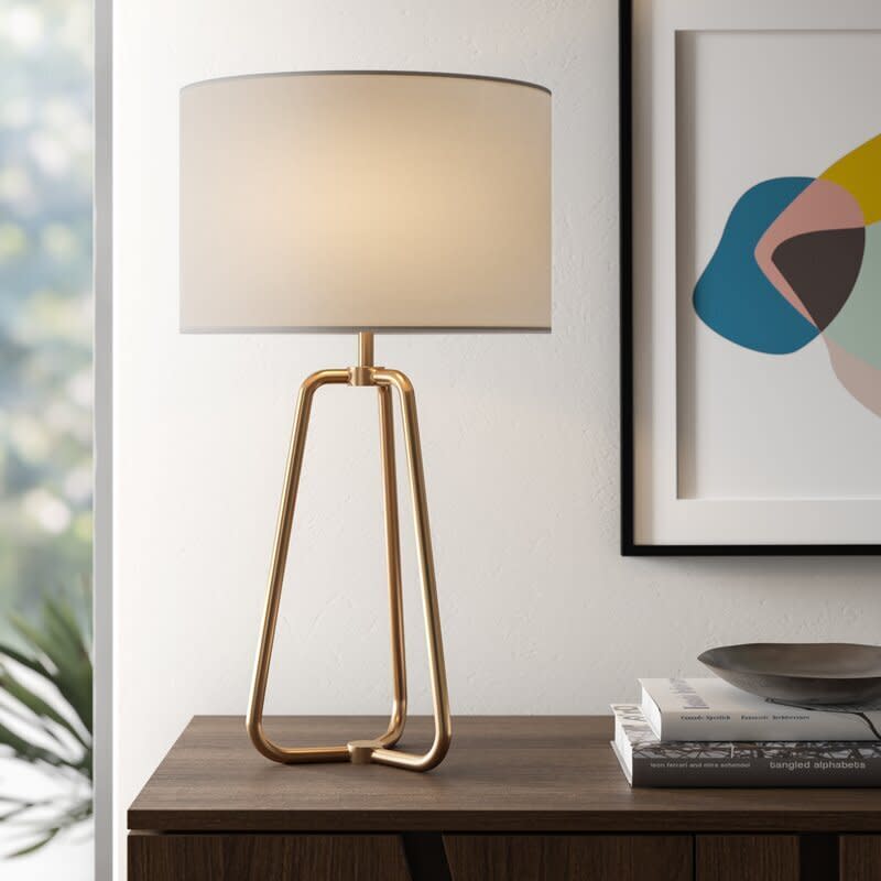 With almost 2,000 reviews and a 4.8-star rating, you won't find a more top-rated lamp on this list. It comes in a brushed nickel and blackened bronze color, too. This LED-compatible lamp has a on/off switch near the socket and almost off-white linen shade. If you're into more of an <a href="https://www.huffpost.com/entry/stores-to-buy-industrial-furniture-and-decor-online_l_5f5a319ac5b62874bc1957a0" target="_blank" rel="noopener noreferrer">industrial look</a>,﻿ this lamp is probably your best bet. It does require a 60-watt bulb. <a href="https://fave.co/2H3xxbU" target="_blank" rel="noopener noreferrer">Find it for $63 at AllModern</a>. 