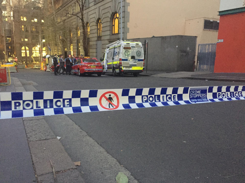 Emergency services at a police cordon in Sydney, Australia near to the scene where a knife attacker was earlier apprehended by members of the public using chairs and a milk crate.