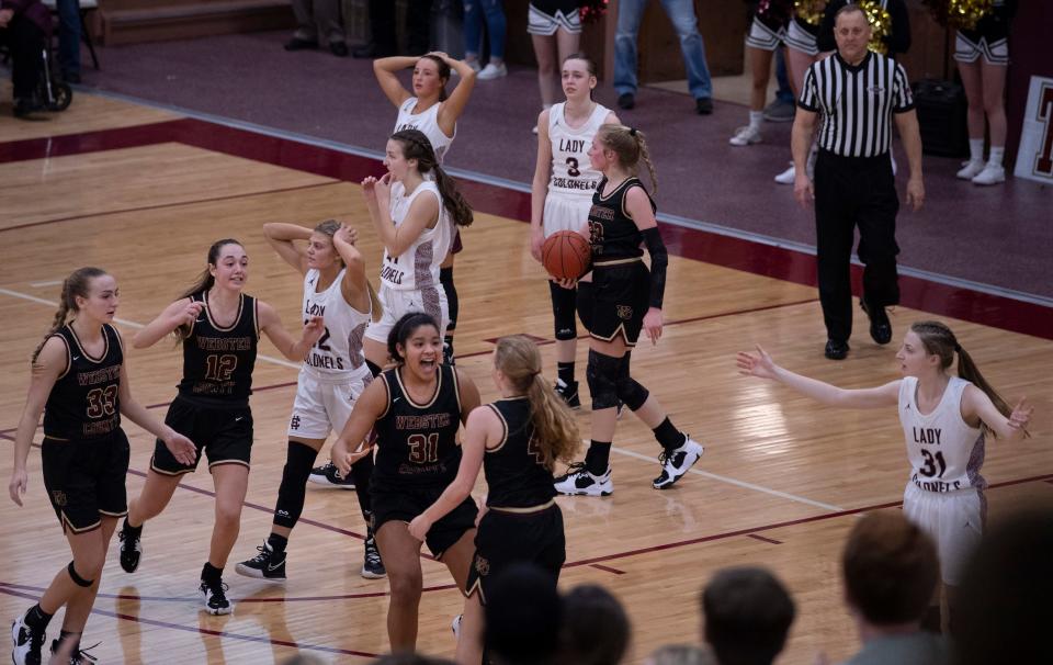 Henderson County is in shock after fouling the 3-point shooter with only a half-second left on the clock and a slim one point lead over Webster County during their game at Henderson County High School Tuesday night, Feb. 8, 2022. Henderson County held a one point lead with a half-second left on the clock when Cates, a freshman with only one other free throw attempt on the season, had to step to the line for three free throws. She missed all three and Henderson won the game 45-44.