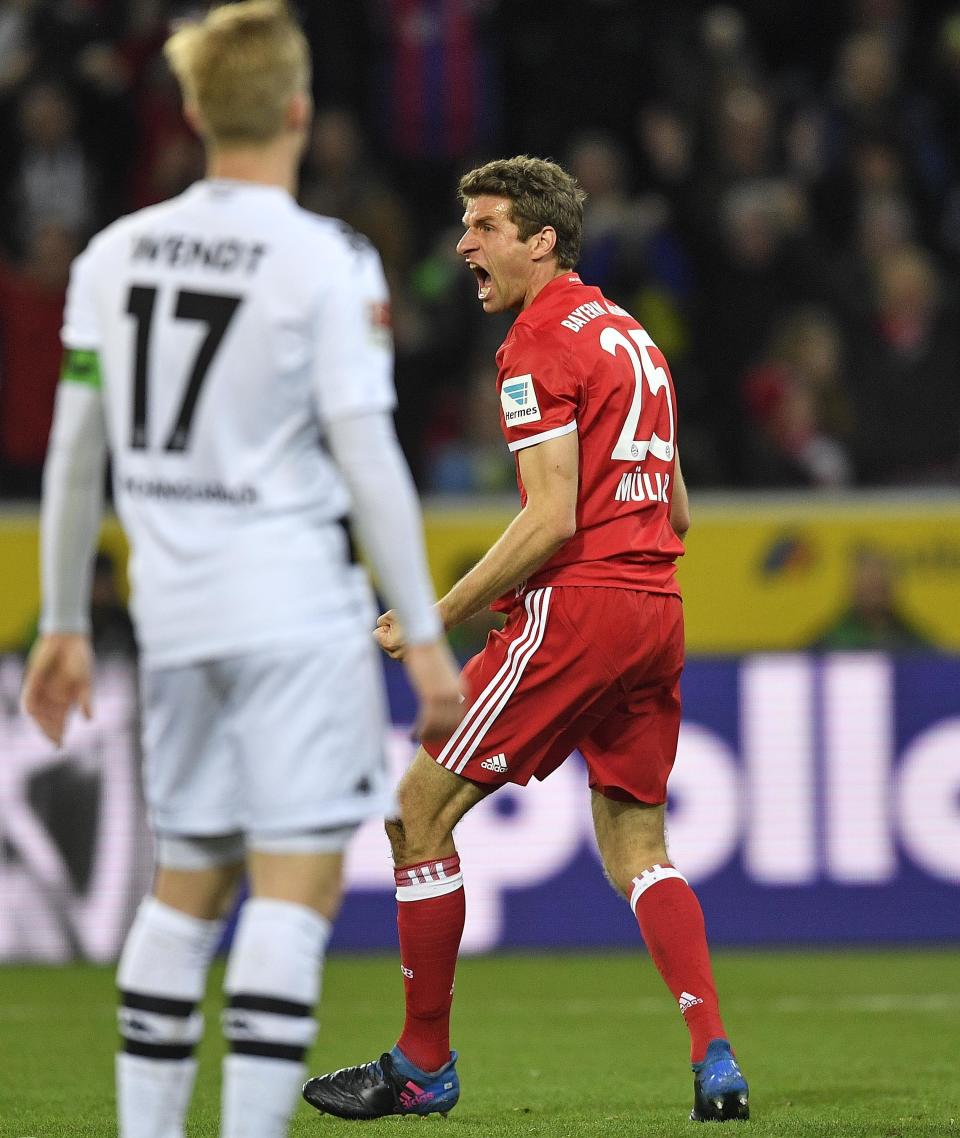 Bayern's Thomas Mueller, right, celebrates after scoring during the German Bundesliga soccer match between Borussia Moenchengladbach and Bayern Munich in Moenchengladbach, Germany, Sunday, March 19, 2017. (AP Photo/Martin Meissner)