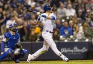 Apr 20, 2019; Milwaukee, WI, USA; Milwaukee Brewers right fielder Christian Yelich (22) hits a home run during the sixth inning against the Los Angeles Dodgers at Miller Park. Mandatory Credit: Jeff Hanisch-USA TODAY Sports