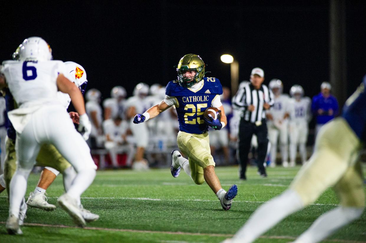 Knoxville Catholic's Braylon Harmon (25) runs the ball during a football game at Knoxville Catholic on Friday, Nov. 3, 2023.