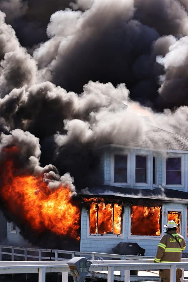 Fire crews respond to massive structure fires at the Old Club property on Wednesday, March 8, 2023, on Harsens Island. The affected area at 9900 S. Channel Drive was closed to traffic while crews investigate the fire's cause.