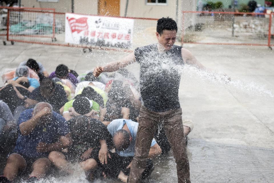 Democracy activists are hit with a water cannon during the 2014 protests (Alex Ogle/AFP/Getty Images)