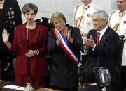 Chile's President Michelle Bachelet (C), Senate President Isabel Allende (L), and outgoing President Sebastian Pinera applaud after Bachelet was sworn in to office in Valparaiso, March 11, 2014. REUTERS/Maglio Perez