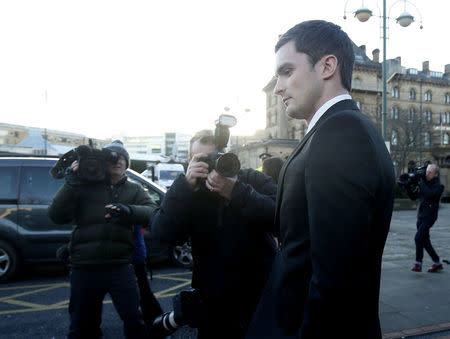 Sunderland soccer player Adam Johnson (R) leaves Bradford Crown Court in Bradford, Britain February 10, 2016. REUTERS/Andrew Yates