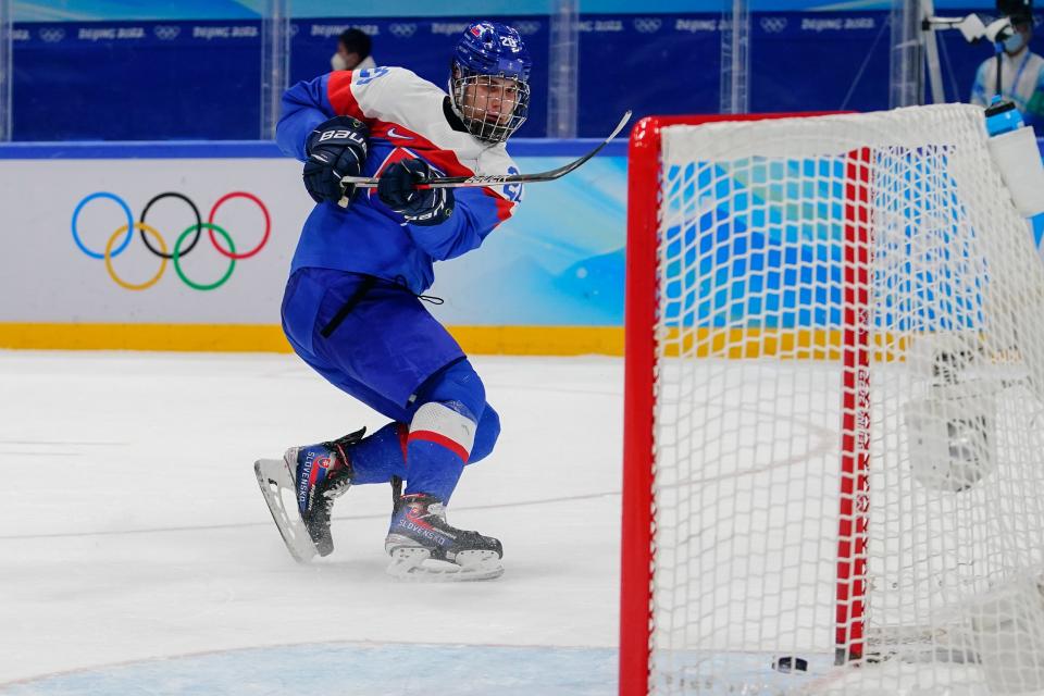 FILE - Slovakia's Juraj Slafkovsky scores an empty net goal against Sweden during the men's bronze medal hockey game at the 2022 Winter Olympics, Saturday, Feb. 19, 2022, in Beijing. Canadian-born center Shane Wright and Slovakian forward Juraj Slafkovsky headline the list of prospects participating at the NHL's pre-draft combine, which resumed in Buffalo this week after being canceled the past two years because of coronavirus pandemic. Both players are scheduled to address the media on Friday, June 3, 2022. (AP Photo/Matt Slocum, File)