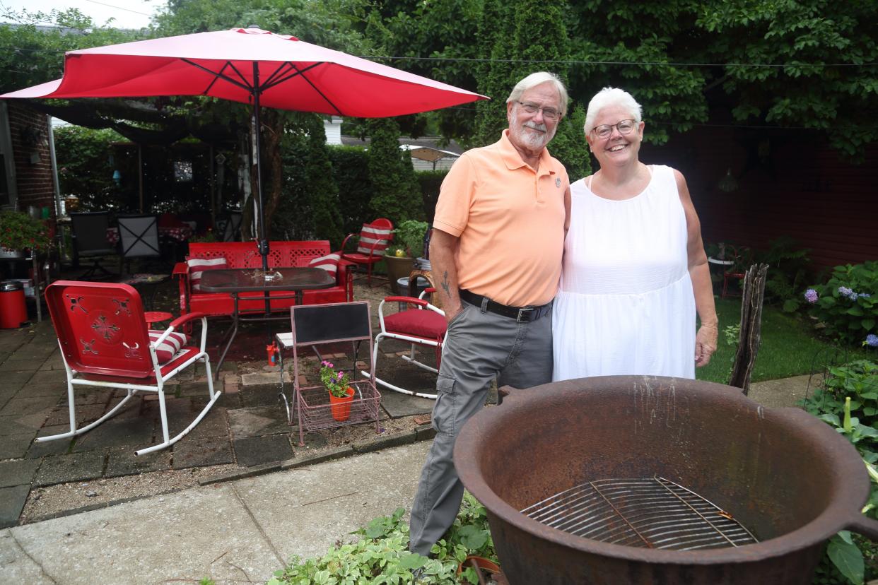 Dave and Joyce Jones, who hold neighborhood parties, outdoor movies, happy hours and Cinnamon Roll Sundays in their yard, are seen at their residence Monday, July 18.