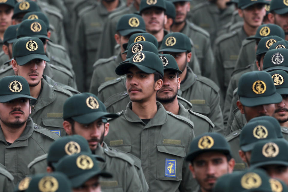 FILE - In this Feb. 11, 2019 file photo, Iranian Revolutionary Guard members attend a ceremony celebrating the 40th anniversary of the Islamic Revolution, at the Azadi, or Freedom, Square in Tehran, Iran. The Trump administration on Wednesday granted important exemptions to new sanctions on Iran’s Revolutionary Guard, watering down the effects of the measures while also eliminating an aspect that would have complicated U.S. foreign policy efforts. (AP Photo/Vahid Salemi)