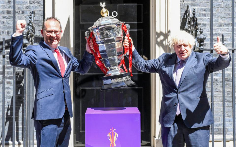 Rugby League World Cup chief executive Jon Dutton with Prime Minister Boris Johnson and the Paul Barriere trophy - Simon Wilkinson/SWpix.com