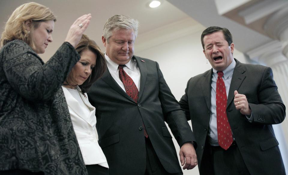 Former Republican Minnesota Rep. Michele Bachmann and her husband Marcus are blessed by Pastor Bill Tvedt and his wife Julie at Jubilee Family Church in Oskaloosa, Iowa.