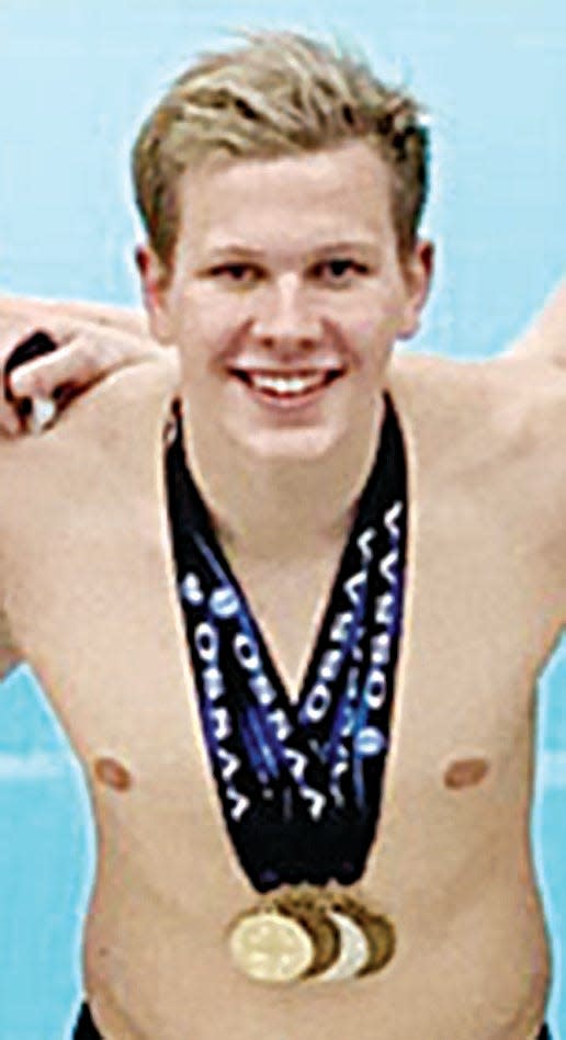 Bartlesville High's Kyle Peterson poses with the medals he seized at the 2021 Class 6A state swimming meet.