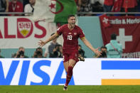 Serbia's Dusan Vlahovic celebrates after scoring his side's second goal during the World Cup group G soccer match between Serbia and Switzerland, at the Stadium 974 in Doha, Qatar, Friday, Dec. 2, 2022. (AP Photo/Ebrahim Noroozi)