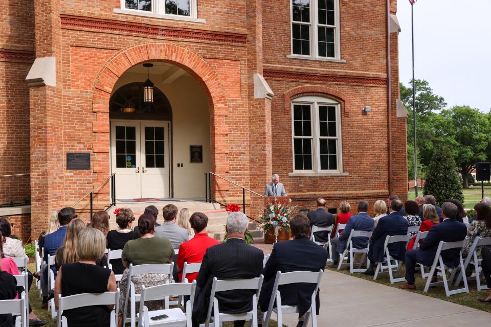 Finis E. St. John IV, the inaugural executive director for the Shelby Institute for Policy and Leadership, speaks April 25 at the ribbon cutting outside the newly renovated Tuomey Hall at The
University of Alabama.