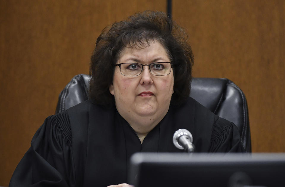 Judge Margaret Van Houten listens to Assistant Wayne County Prosecutor Matthew Penney deliver his opening remarks during the trial of former Michigan state trooper Mark Bessner, Wednesday, April 10, 2019, Detroit. Bessner is charged with second-degree murder in the death of 15-year-old Damon Grimes in 2017. It's the second trial after a jury last fall couldn't reach a unanimous verdict. (Clarence Tabb Jr./Detroit News via AP)