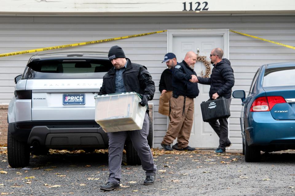 FILE - Officers investigate the deaths of four University of Idaho students at an apartment complex south of campus (Â©Daily News)